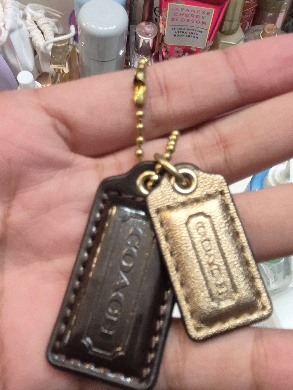 Coach Dual Leather Tag Keychain in Brown and Gold